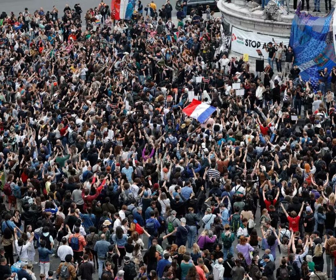 107614207-people-wave-national-flags-during-an-election-night-event-following-the-first-results-of-t.jpeg