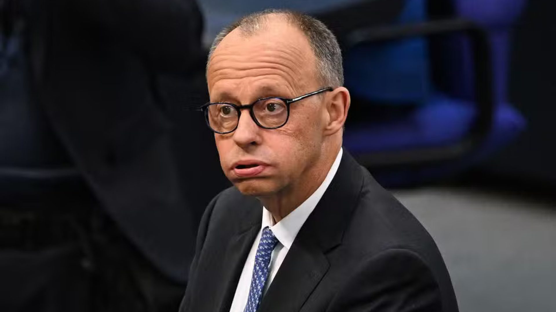 110951333-designated-german-chancellor-friedrich-merz-reacts-as-he-arrives-at-the-plenary-hall-for-t.jpeg