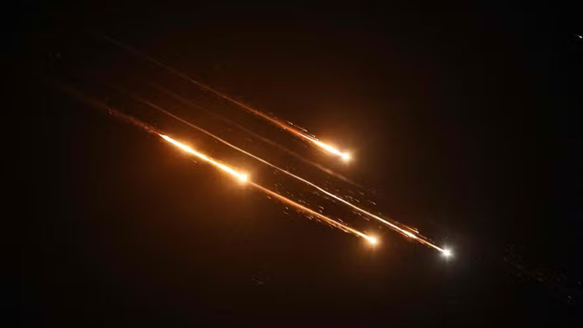 111397791-debris-of-missiles-fired-from-iran-toward-israel-leave-trails-in-the-night-sky-over-na.jpg