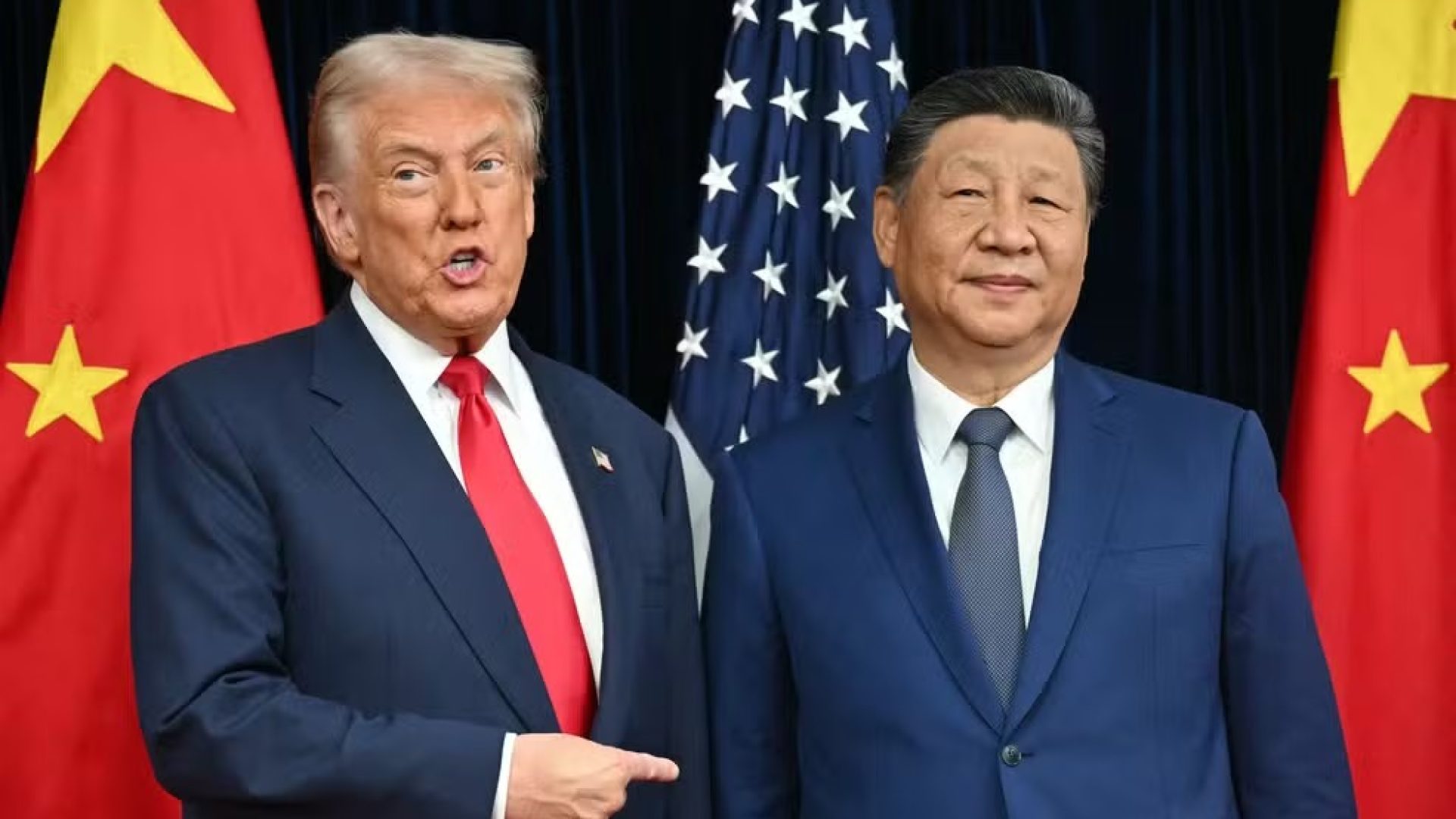 112859967-topshot-us-president-donald-trump-l-and-chinas-president-xi-jinping-greet-each-othe.jpg