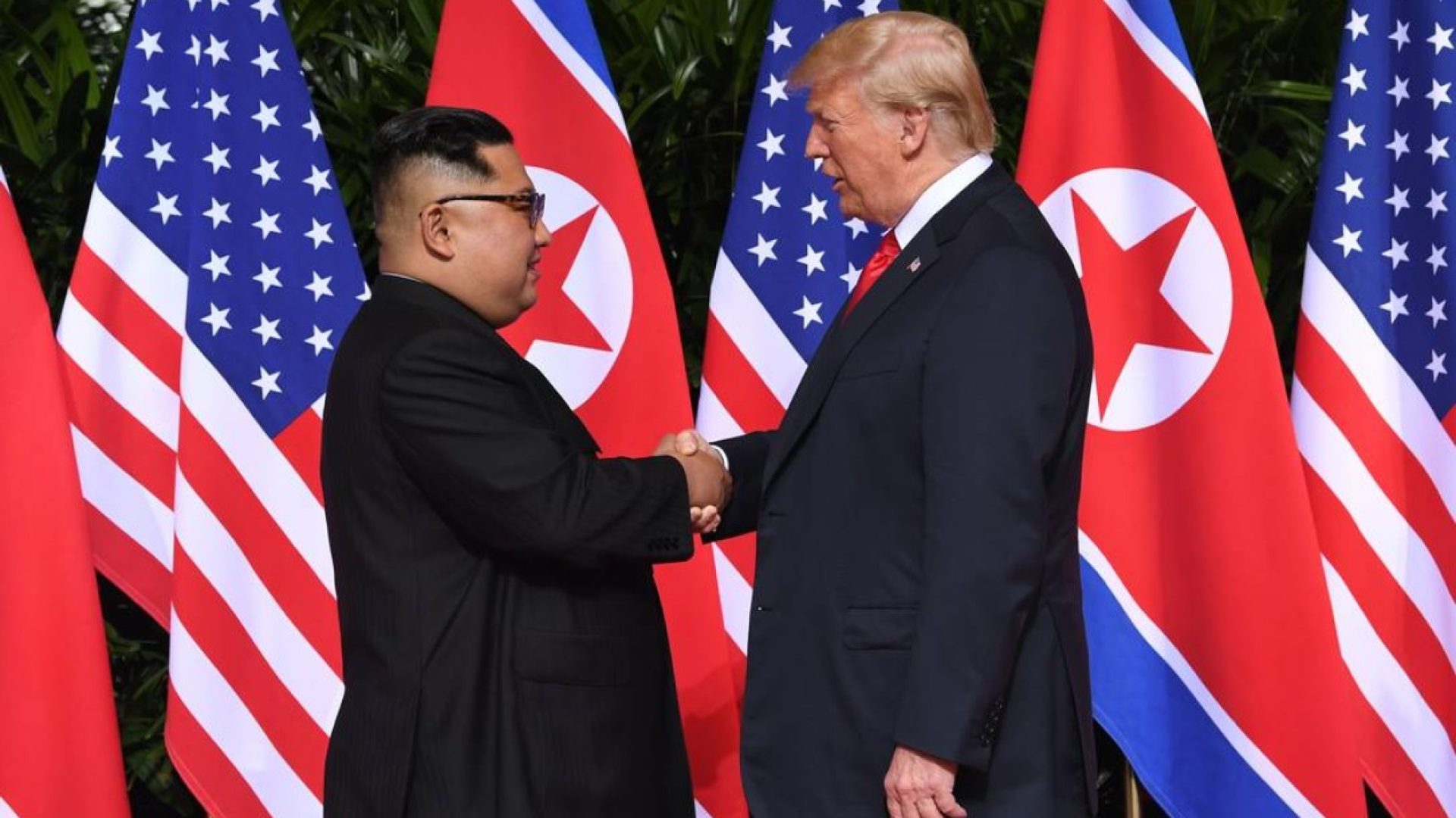 77267162_North-Korea27s-leader-Kim-Jong-Un-L-shakes-hands-with-US-President-Donald-Trump-R-at-the-st.jpeg