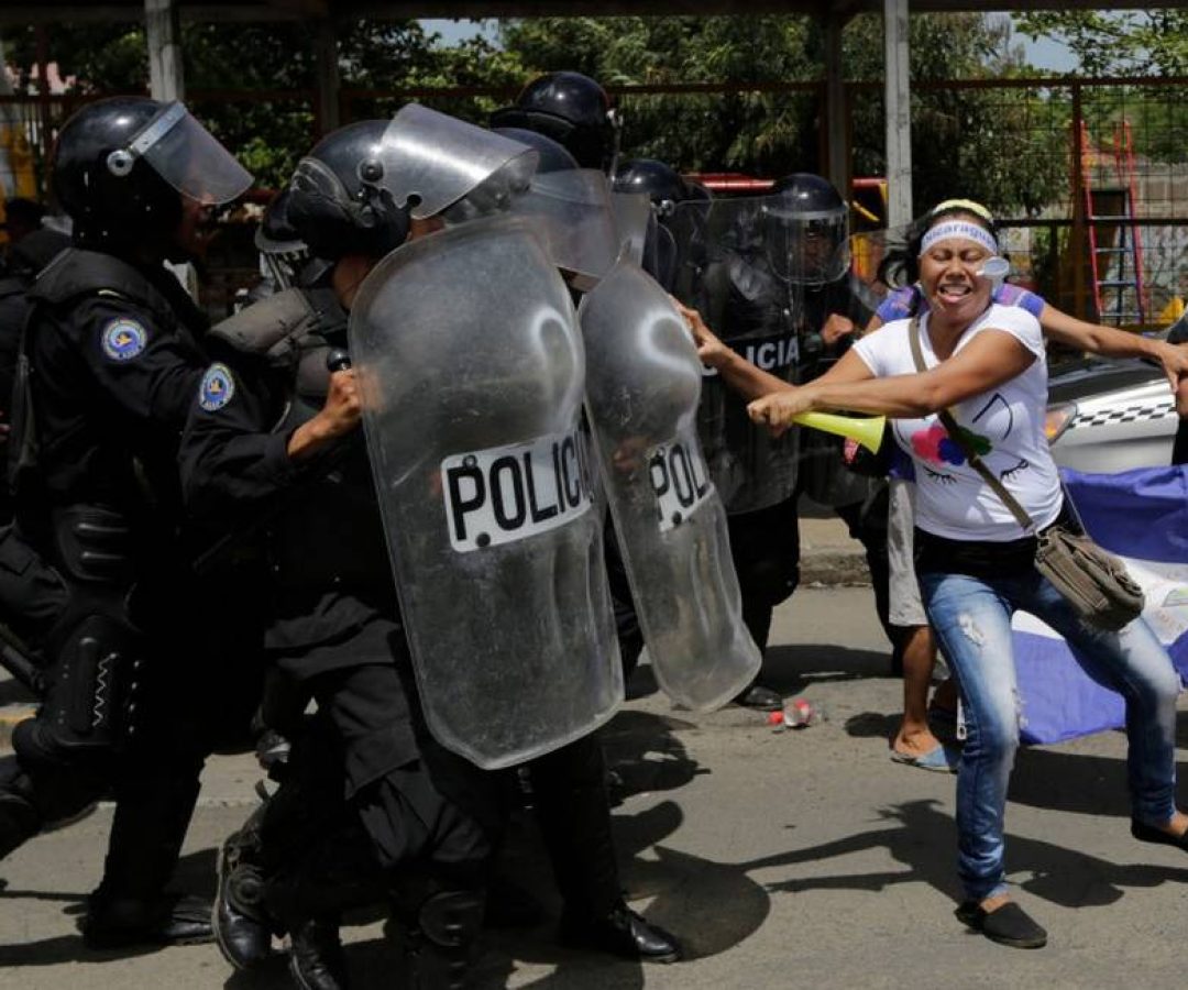 79009080_TOPSHOTWomen-clash-with-riot-police-blocking-a-street-during-a-protest-against-Nicaragua.jp_.jpeg